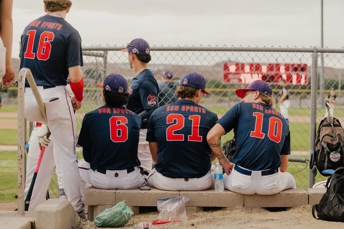 Redbirds players together near the field